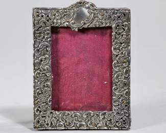 STERLING PICTURE FRAME | Sterling silver repousse picture frame, insert 2.75 x 3.75 in. - w. 4.5 x h. 6 in. (overall)
