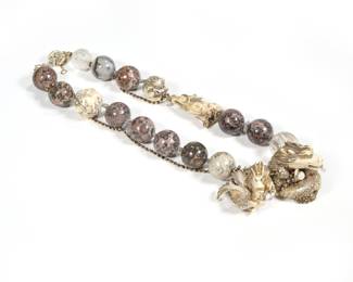 NECKLACE MADE FROM NETSUKES & CARVED AGATE ORBS | Having 11 carved spherical agate beads (21 mm.), two glass (or rock crystal) carved beads, plus five variously sized carved bone netsukes; one a horned lion [komainu], two coiled serpents, one mythical creature curled into a ball, and one netsuke carved with twelve animals of the zodiac.  - l. 19 in.