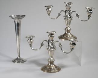 (3pc) GORHAM & OTHER WEIGHTED STERLING | Including a pair of Gorham weighted reinforced candelabras (h. 8.5 x 12 x 4.5 in.) and a sterling weighted trumpet vase (h. 11 in.)
