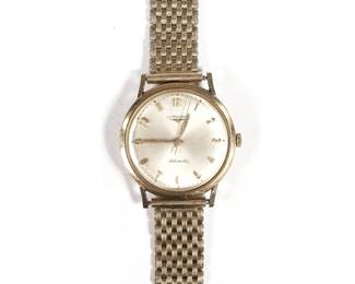 LONGINES GOLD-FILLED WRISTWATCH | Men's Longines automatic wristwatch, 10k gold filled case on a 1/20-12k gold filled band. -  l. 8 in.
