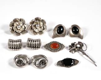 MISC. STERLING JEWELRY | Including an antique German openwork pin with marcasite and faceted black stone, a marcasite and carnelian sterling pin, two pairs of Danecraft earrings, a pair of Mexico Silver flower-form earrings, a pair of Mexican TS-62 cabochon earrings, and a flower-form pin; all together 2.72 ozt.
