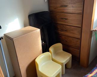 Five-drawer dresser; children’s craft-table chairs.