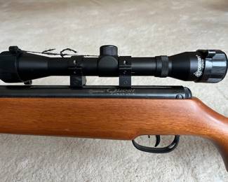 Close-up look at Crosman Quest 1000x pellet rifle with Crosman 4x32 scope.