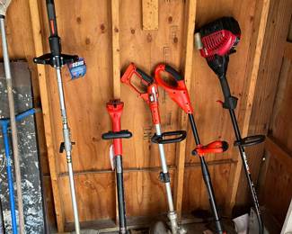 Selection of both battery-powered and electric weed whippers by Troy-Bilt, Black & Decker, Echo and others.