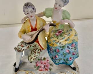 $95 - Musician and lady porcelain figures