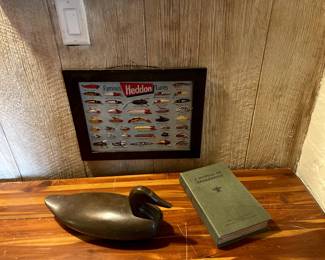 Cedar Chest, $475. Wood Duck Decoy, $175. Heddon Lure Metal Sign Advertisment, $95. Fake Book Storage Box, $35