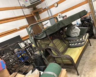 Several pieces of outdoor furniture. Out door swing. Wicker-like couch, 2 chairs with ottomans and coffee table. 8 metal swivel chairs