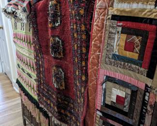 Antique silk quilt, vintage bokara throw rug, and wall hanging