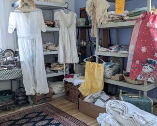 Rugs, linens, and silver serving ware