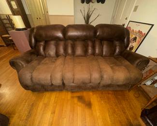 Reclining sofa. Not electric. Seat is in good condition. Poor lighting and flash on camera 