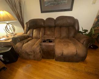 Reclining loveseat. Not electric. With center console. Seat in good condition. Poor lighting and flash from camera 