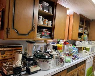Crock pots, vintage blender by Panasonic, microwave and so many utensils 