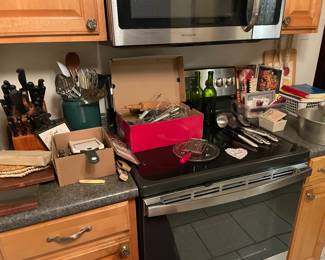 Tons of kitchen items!  Knives, utensils, dish sets, mugs, appliances 