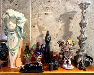 2 plus foot silver metal candle holders. Art Nouveau porcelain handmade vase. Wonderful quirky dog art piece handmade and from an art festival. Sunglass's and Sony small camera with battery charger. Glass vintage Roosters