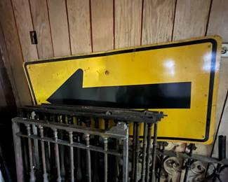 Arrow sign and metal gates/fencing