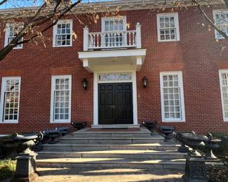 MOST OF THE URNS ARE ON THE FRONT STEPS