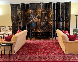 PAIR OF SPECTACULAR early 20th century Ming style carved lacquer Chinese screens with 6 20” panels each. As shown each spreads about 7’ wide. Stands 9’ tall and shown here together. The rug and sofas are not for sale.