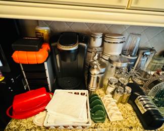 Keurig coffee machine, magic bullet, knife sharpener, canisters, can opener, butter storage dishes
