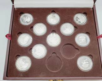 (11) Proof 1 Troy Ounce Silver Grand Slam Rounds in Wood Display Case.
