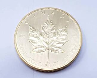 #128 • 1 Oz Canadian Maple Leaf .9999 Gold Coin
