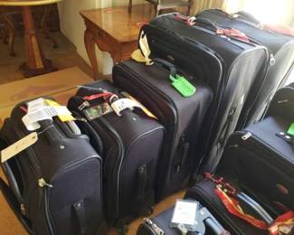 #12064 • 5 American Tourister Suit Cases
