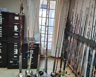 #2318 • 11 Fishing Poles with 7 Reels
