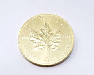 #124 • 1 Oz Canadian Maple Leaf .9999 Gold Coin
