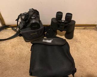#10582 • Nikon CoolPix Camera with Case, Emerson Binoculars and Busnell Binoculars
