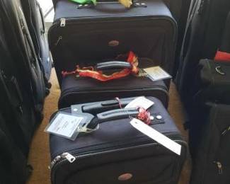 #12062 • 5 American Tourister Suit Cases
