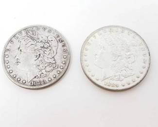 #218 • 1884-O And 1883 Morgan Silver Dollars
