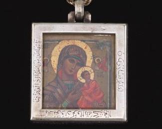 A Miniature Russian Icon Set in a Silver Cartier Frame 