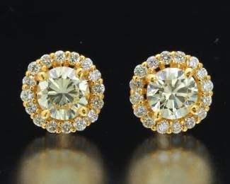 A Pair of Yellow Diamond Stud Earrings 