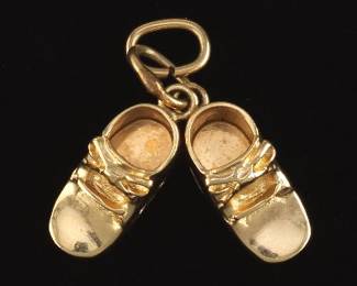 A Cute Gold Charm of Baby Shoes 