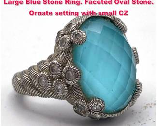 Lot 1988 JUDITH RIPKA Sterling Silver Large Blue Stone Ring. Faceted Oval Stone. Ornate setting with small CZ