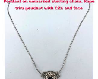 Lot 1932 JUDITH RIPKA Sterling Silver Pendant on unmarked sterling chain. Rope trim pendant with CZs and face