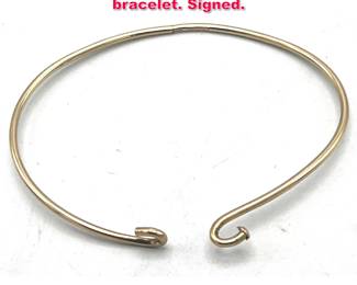 Lot 1867 18K yellow gold CARTIER wire bracelet. Signed.