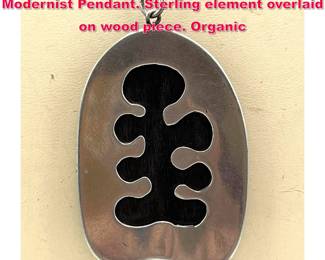 Lot 1723 Organic Sterling Silver and Wood Modernist Pendant. Sterling element overlaid on wood piece. Organic