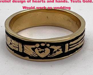 Lot 1849 18K YG Gold Band Ring. Band has relief design of hearts and hands. Tests Gold. Would work as wedding