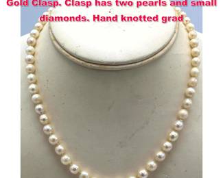 Lot 1855 Pearl Necklace with 14K White Gold Clasp. Clasp has two pearls and small diamonds. Hand knotted grad