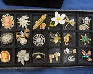Collection of vintage brand name brooches
