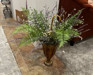 Cute umbrella stand with artificial flowers