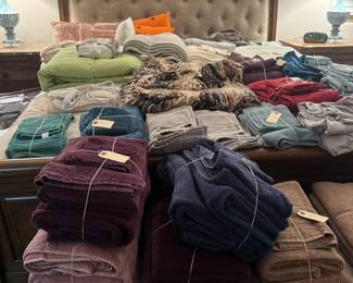 Lots and lots of linens sheets, towel sets comforter sets, pillows down comforters, a very well equipped house