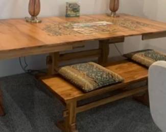 A really fantastic table that has two large leaves in it. This was used as a puzzle table, sewing table, game table, entertainment, table, dining table, indoor outdoor! Comes with long bench, and two side benches! This is absolutely beautiful!