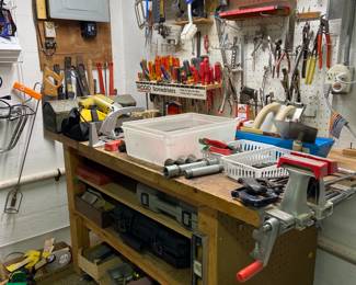 Basement workshop full of tools.  To the right in the corner is the perfect addition to any basement......a dehumidifier!!!
