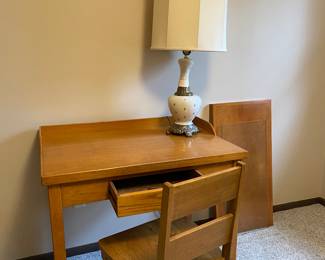 One of several desks (and lamps) offered for sale.