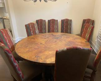 Copper top diningroom table with ten chairs