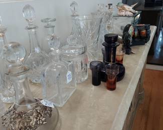 Many crystal decanters