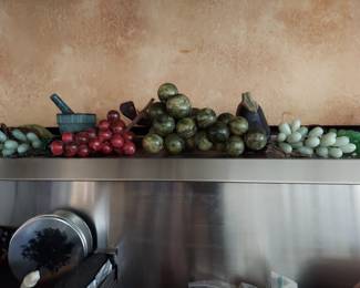 Grape clusters, stone and glass assortment