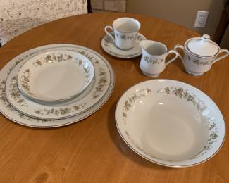 8 piece place setting china. With serving bowl,platter and cream and sugar. 