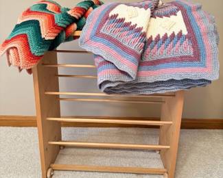 Multicolored Crochet Blankets And Rack on Wheels
